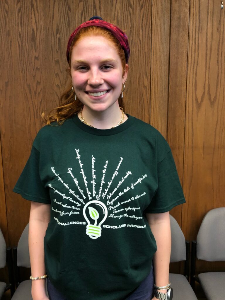 Female Student Alyssa Bockman with her Grand Challenges T-shirt on