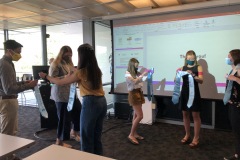 Asha Buehler presenting stolls to the rest of the scholars